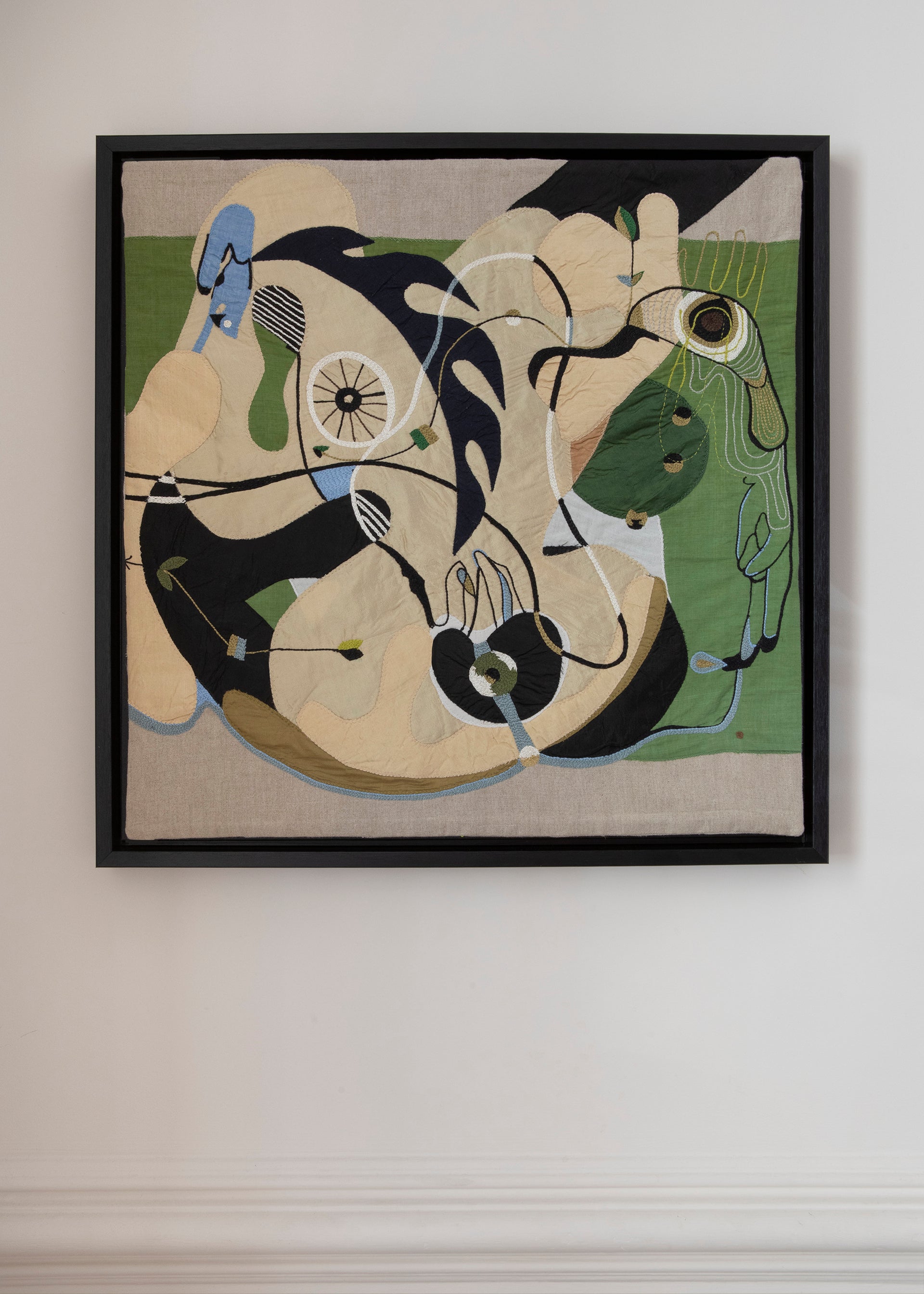 Hand made decorative tapestry with an abstract and surrealist design motif. Hand crafted and hand embroidered from antique silks. Made in India, artisanal home decor. Modern tapestry design. 